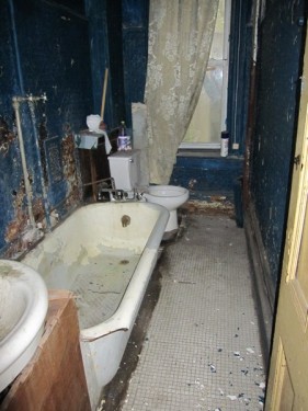 Delapidated wreck of a bathroom in a Harlem townhouse Delapidated wreck of a bathroom in a Harlem townhouse