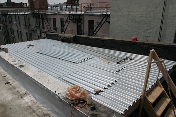 Metal decking for a Harlem townhouse roof Metal decking for a Harlem townhouse roof