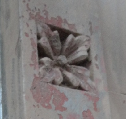 Rosette in brownstone façade