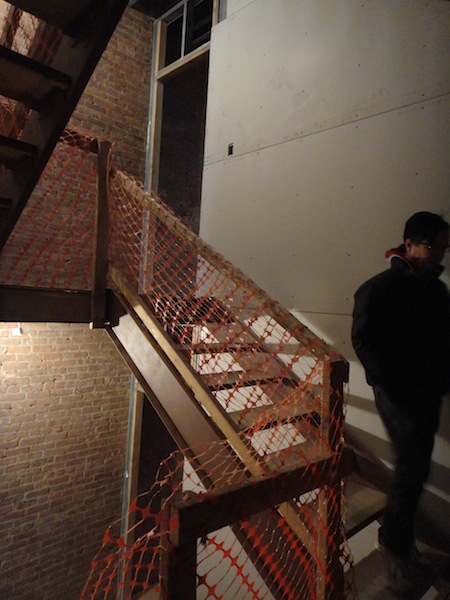 Dan in stairwell with drywall going up Dan in stairwell with drywall going up