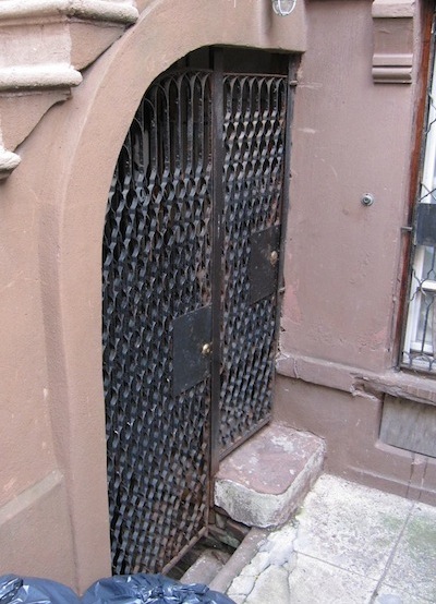 original gates under stoop on Harlem brownstone original gates under stoop on Harlem brownstone